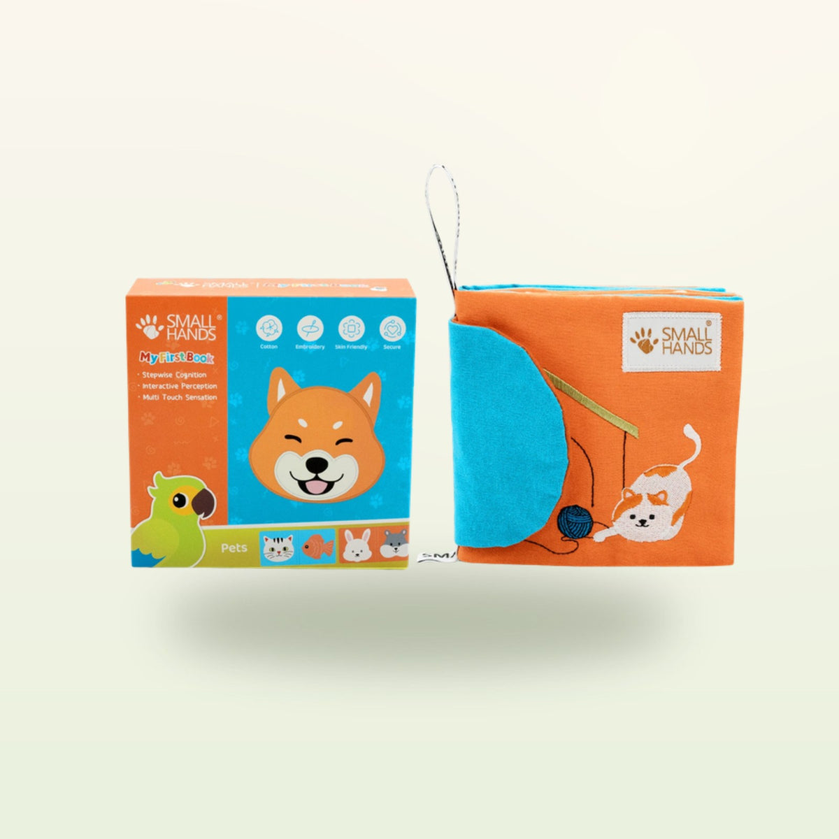 Small Hands Pets Montessori sensory book – packaging with book, Shiba dog and playing cat on a soft cream background – from 0 months