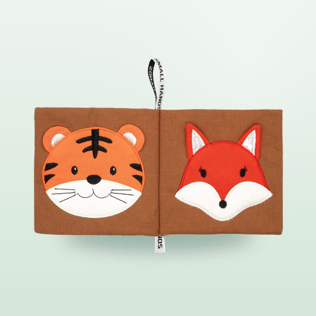 Small Hands Wild Animals sensory cloth book double page with tiger and fox on a soft forest green background – from 0 months