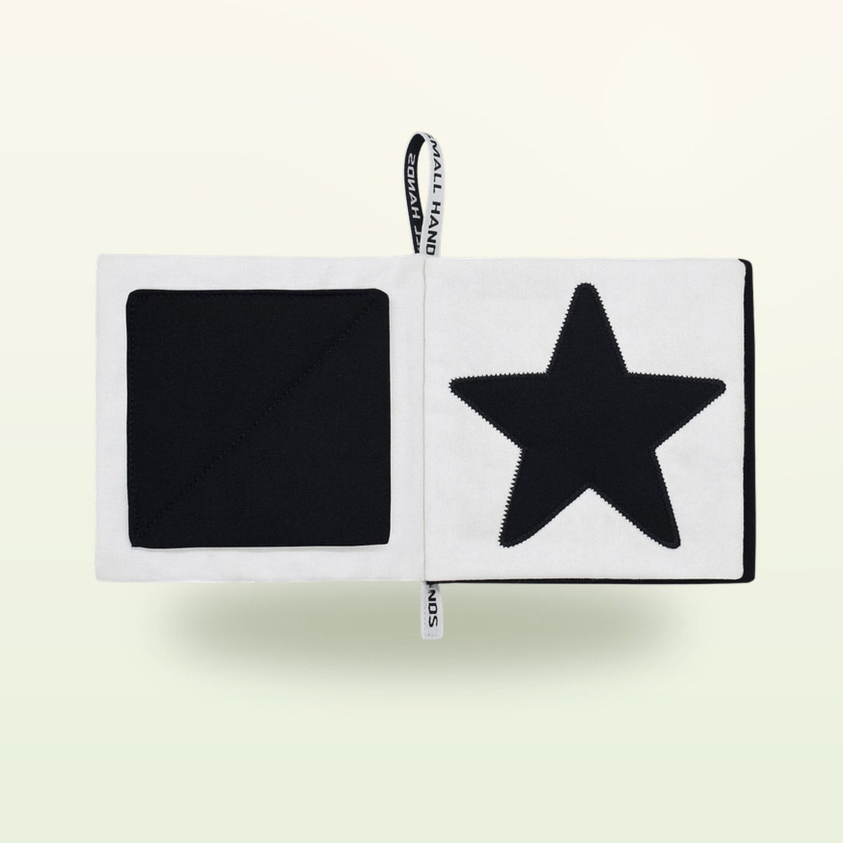Small Hands Shapes contrast book open – black square and large star on a soft cream background – from 0 months