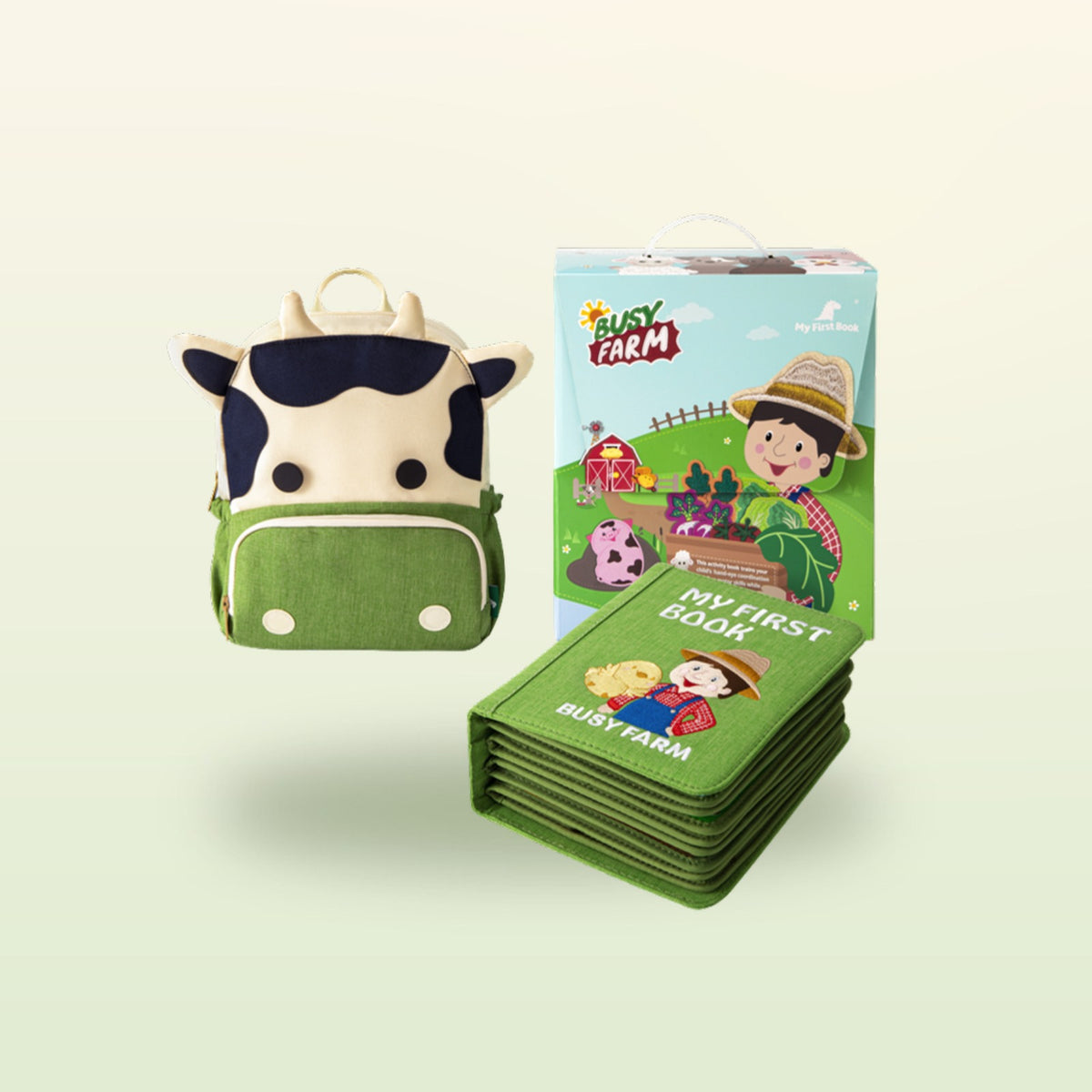 My First Book farm quiet book set – children's backpack, book and gift box on a soft meadow background