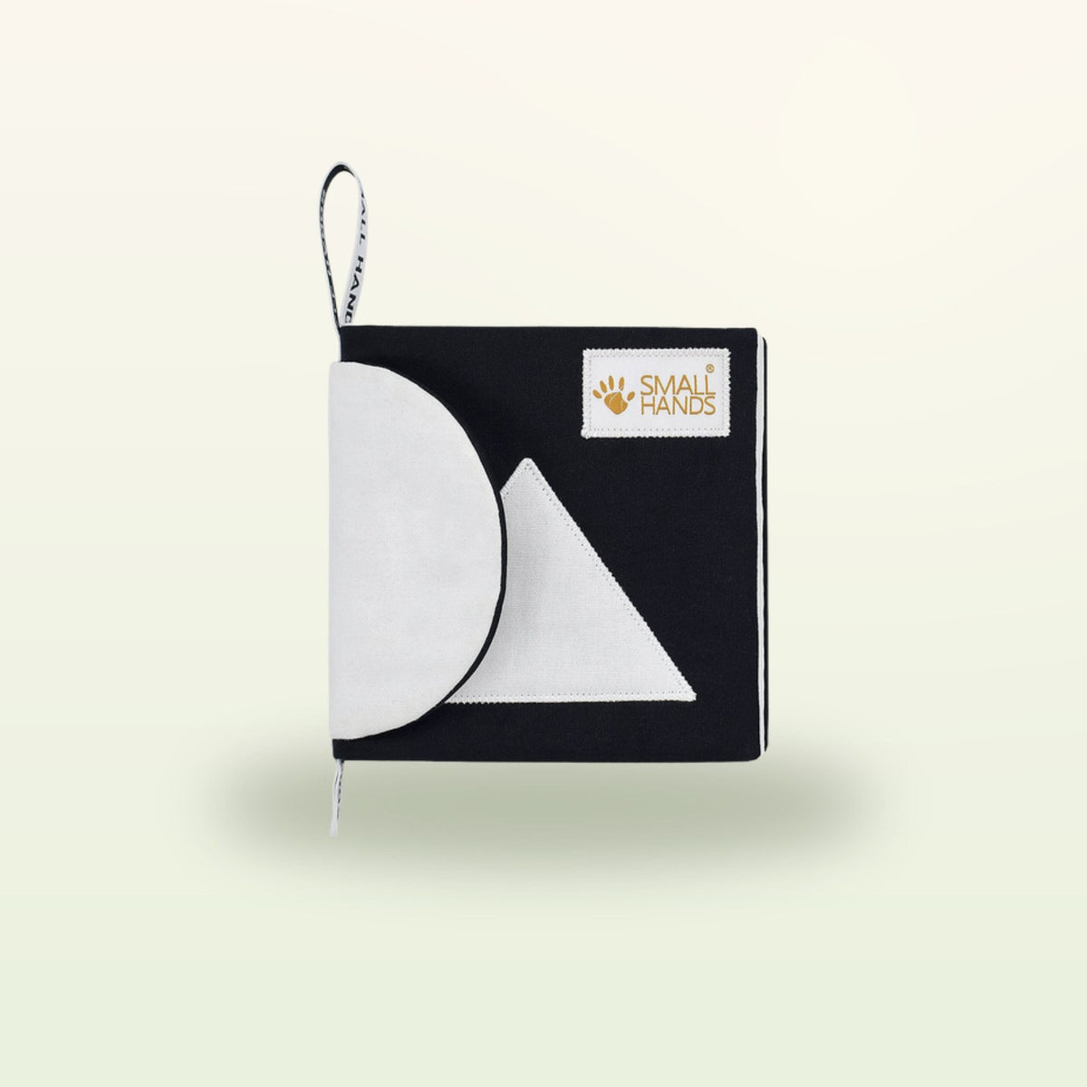 Small Hands Shapes Montessori contrast book – cover with white circle and triangle on a soft cream background – from 0 months
