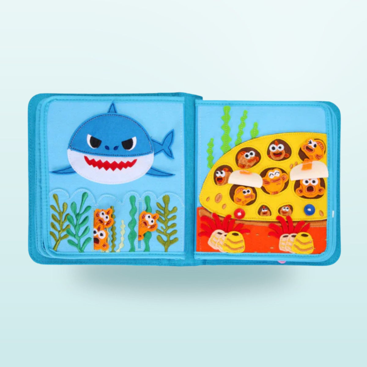 Baby Shark quiet book double page with underwater house and hidden flaps to explore on a soft sea background – from 3 years