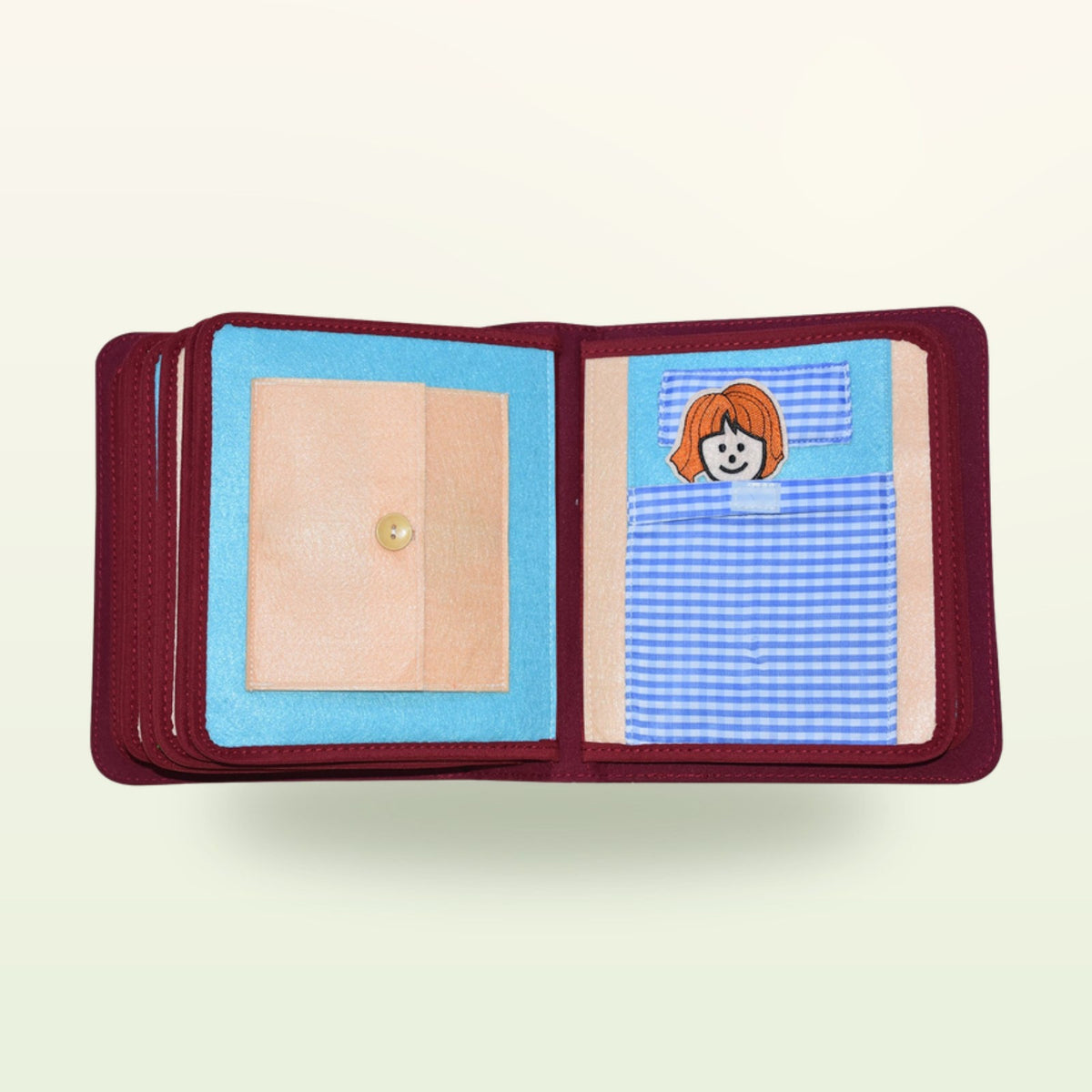 My Everyday quiet book bedtime double page with child in bed to tuck in with a buttoned blanket on a soft cream background – from 1 year