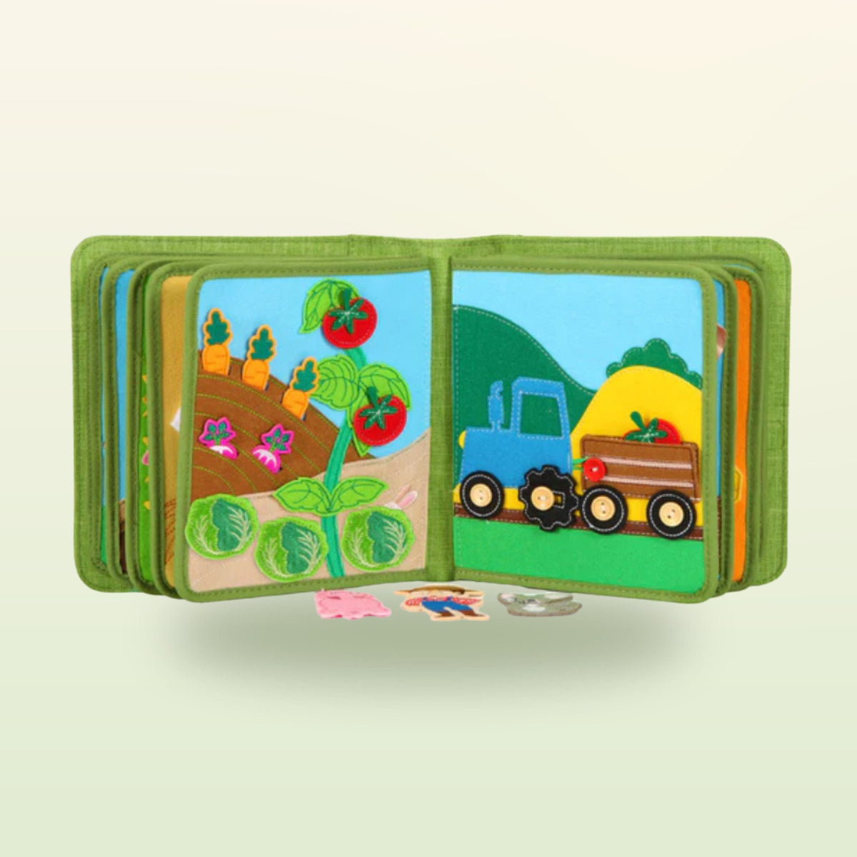 Farm quiet book page: vegetable garden with removable tomatoes and carrots and a blue tractor – on a soft meadow background