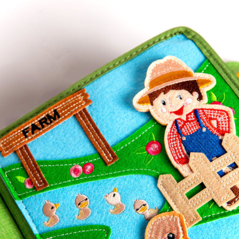 Busy Farm quiet book inside page with farmer, fences and animals
