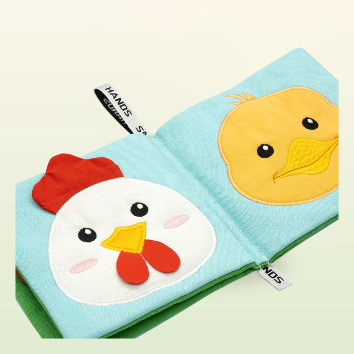 My First Book Small Hands Farm cloth book close-up of hen and chick on a soft meadow green background – from 0 months