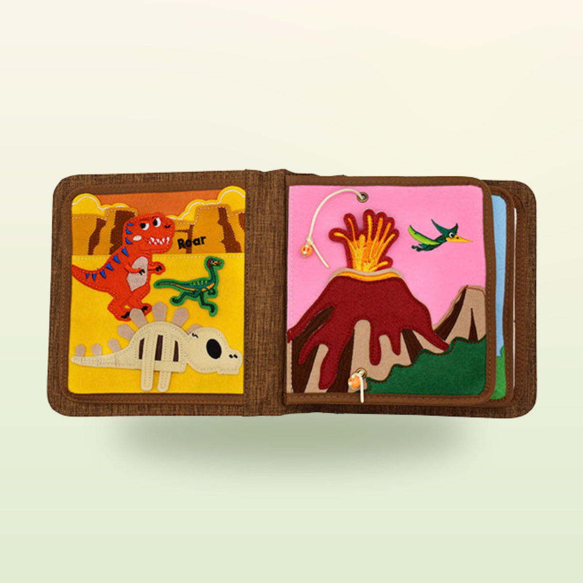T-Rex quiet book page with roaring T-Rex and erupting volcano with pterosaur on a soft jungle-green background – from 1 year