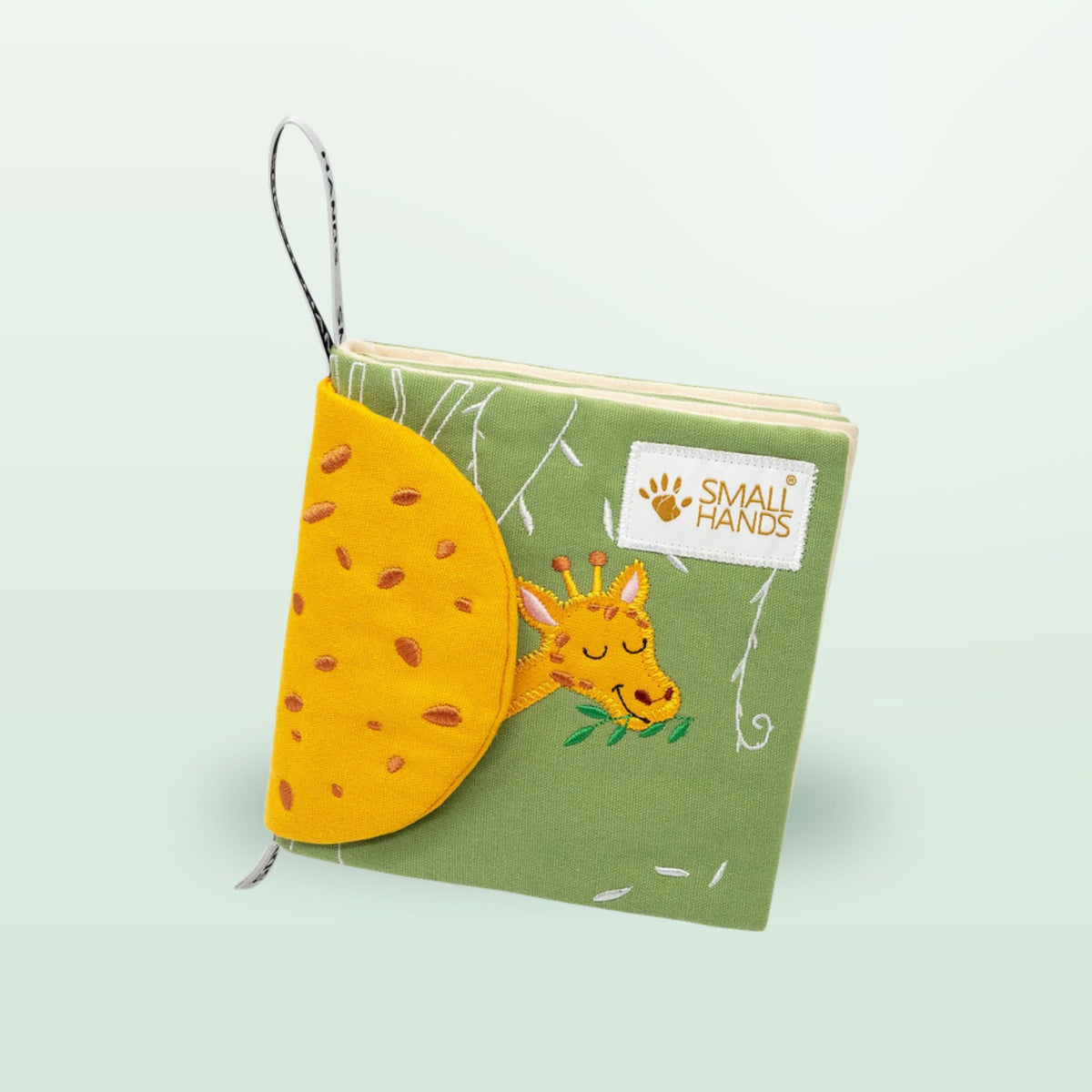 Small Hands Animals of Africa Montessori cloth book standing with giraffe on a soft forest green background – from 0 months