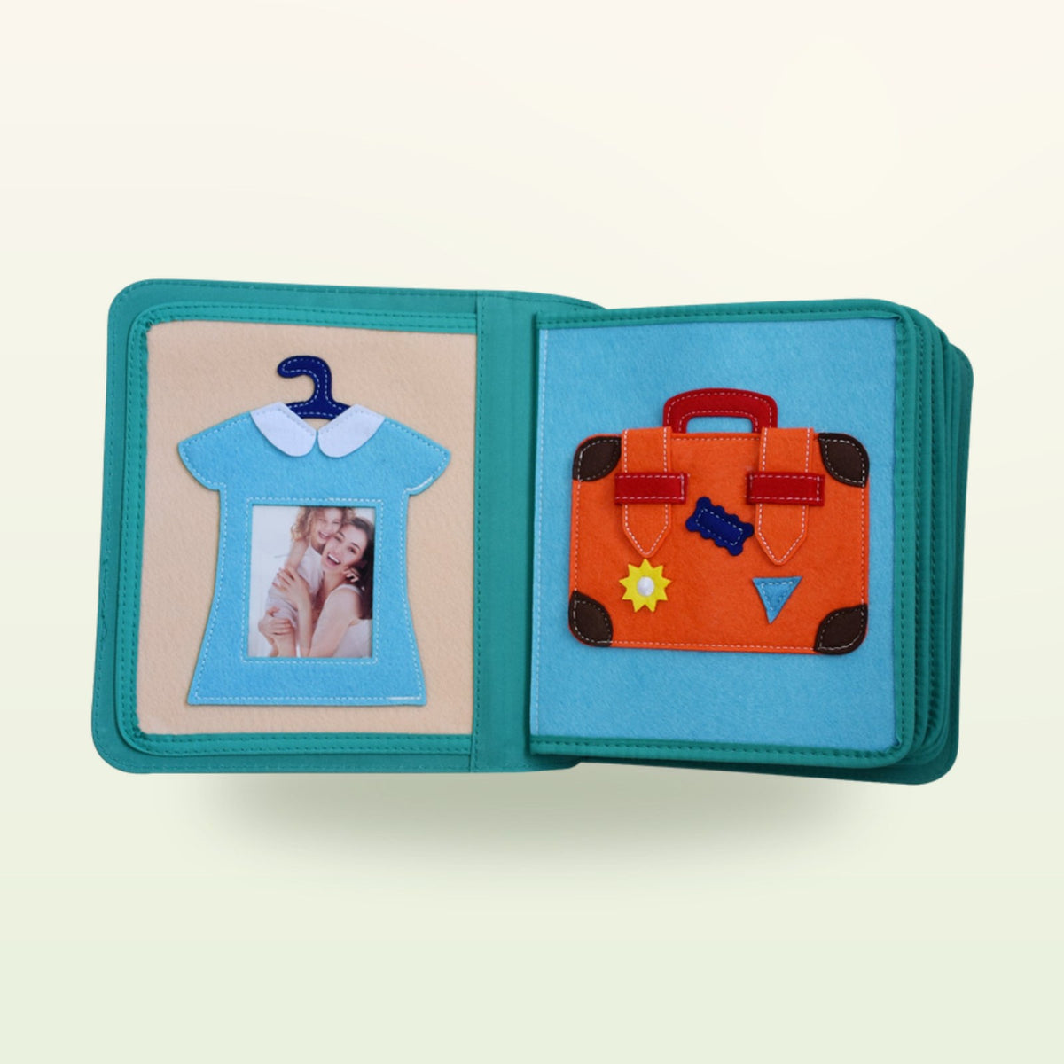Dressing book fabric page with felt shirt on a hanger and suitcase with hook-and-loop fastener on a soft cream background – from 3 years