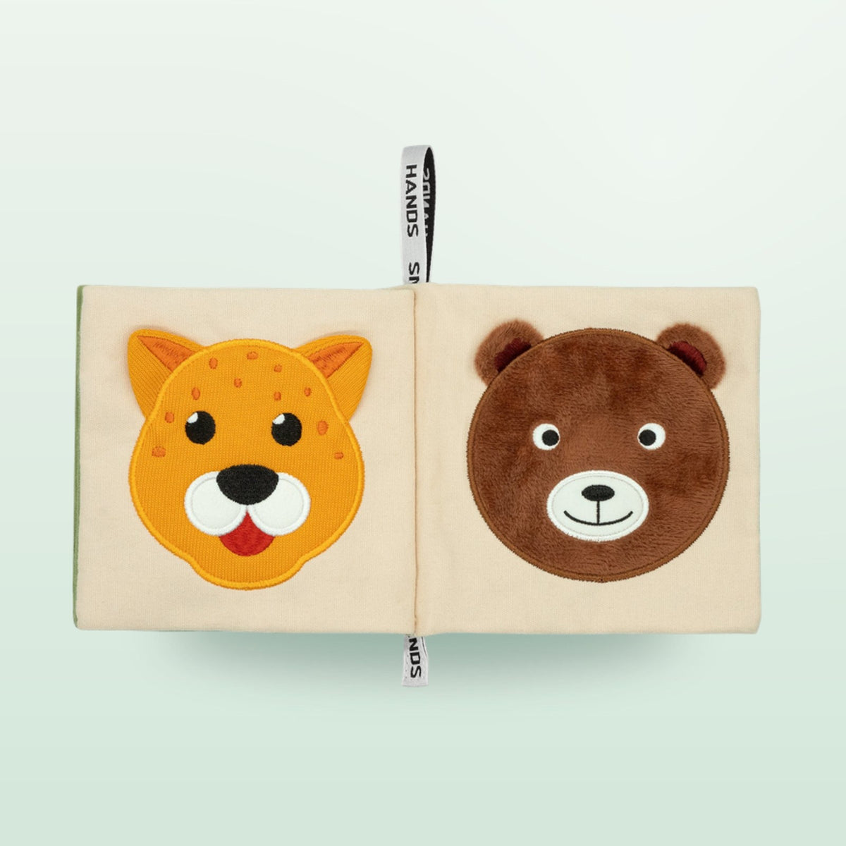Small Hands Animals of Africa Montessori cloth book double page with cheetah and bear on a soft forest green background – from 0 months