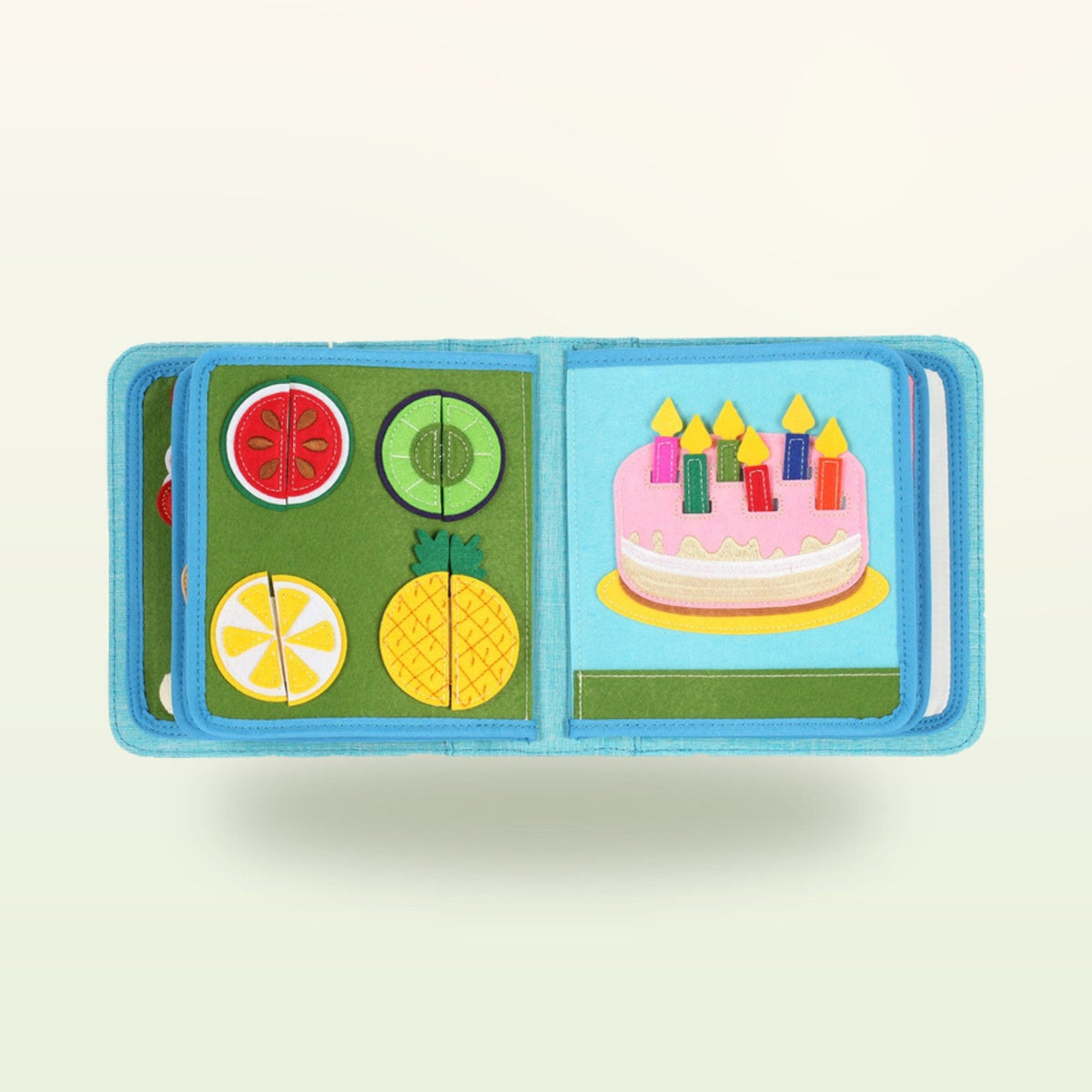Little Foodies quiet book page with felt fruit to cut and birthday cake on a soft cream background – from 1 year