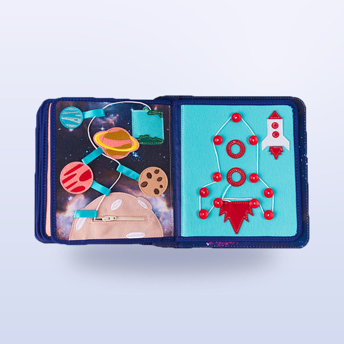 Space quiet book page with threading rocket made of red buttons, planet path and zip pocket on a soft space background – from 3 years