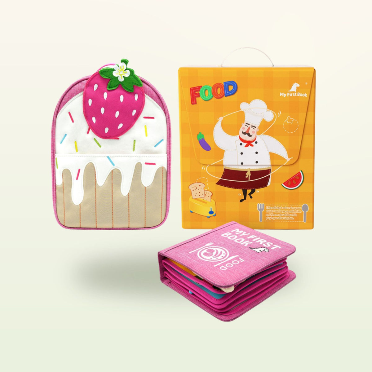 Little Foodies Montessori quiet book with strawberry backpack and gift packaging on a soft cream background – from 1 year