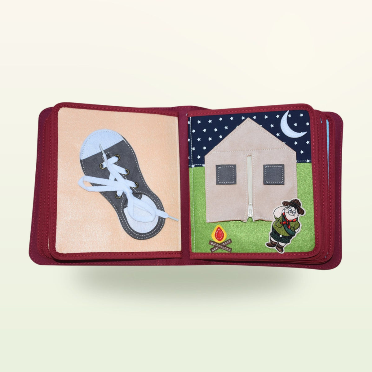 My Everyday quiet book double page with lace-up shoe and house with zip door at night on a soft cream background – from 1 year