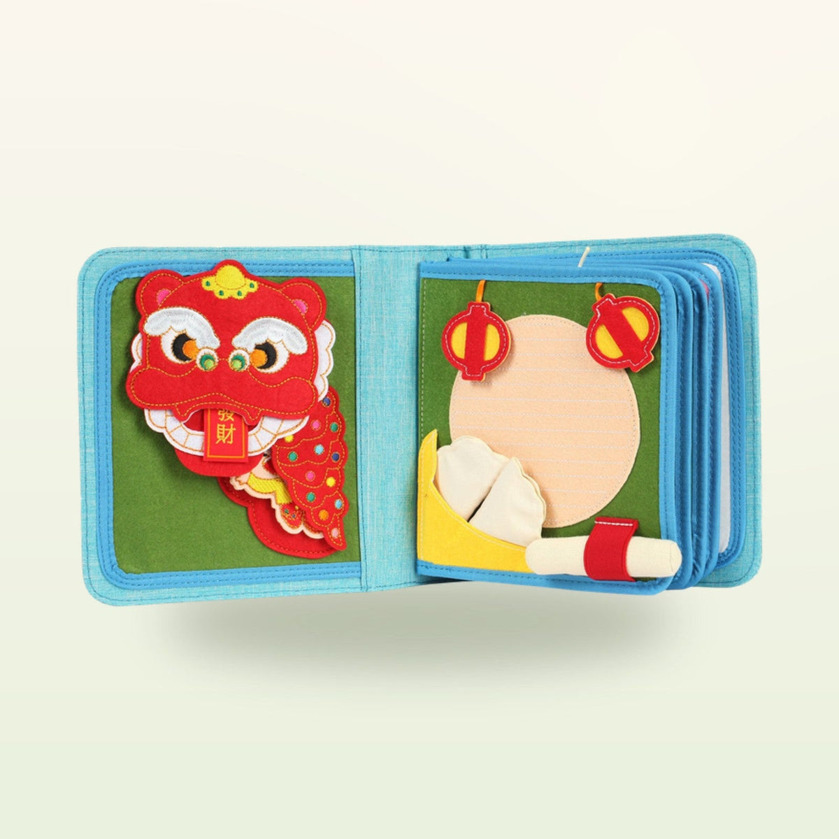 Little Foodies quiet book page with Chinese New Year scene, lion dance head and dough preparation on a soft cream background – from 1 year