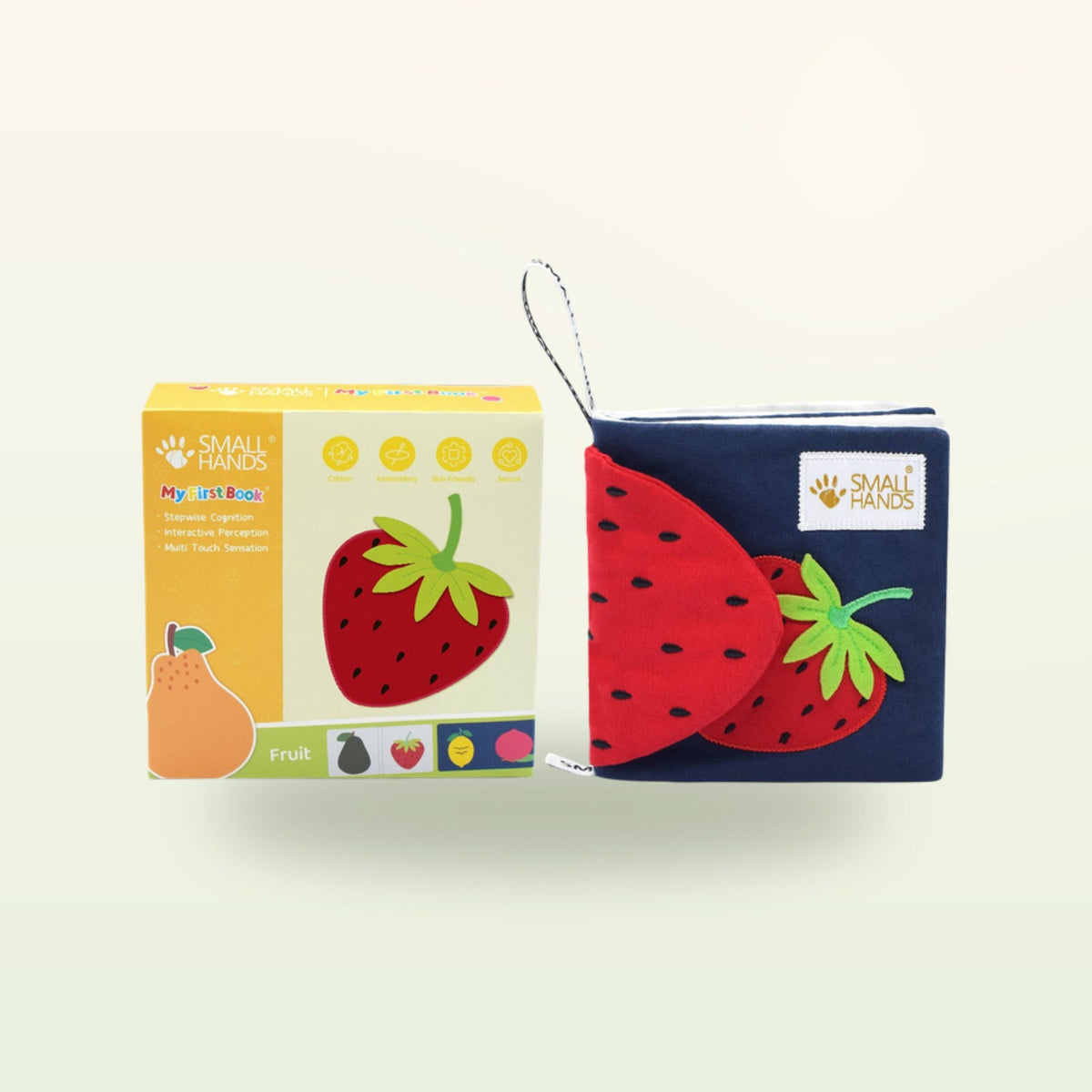 Small Hands Colorful Fruits Montessori sensory book – packaging with book and red strawberry on a soft cream background – from 0 months