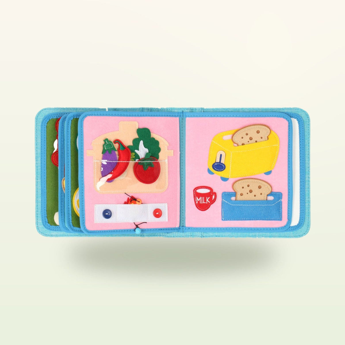 Little Foodies quiet book page with felt vegetables in the pot and yellow toaster on a soft cream background – from 1 year