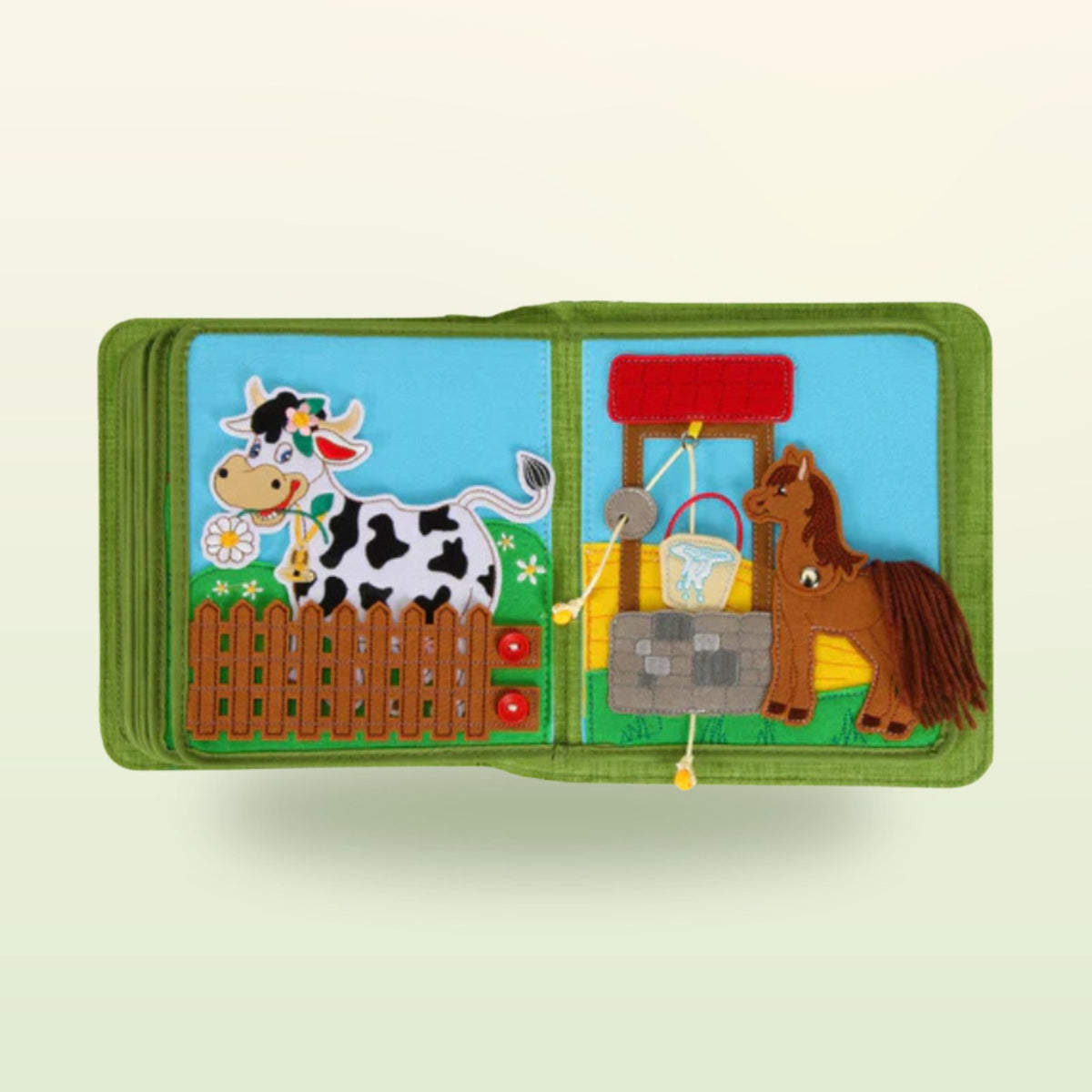 Farm quiet book page: cow at the fence with press studs and horse at the well with a bucket to pull up – on a soft meadow background