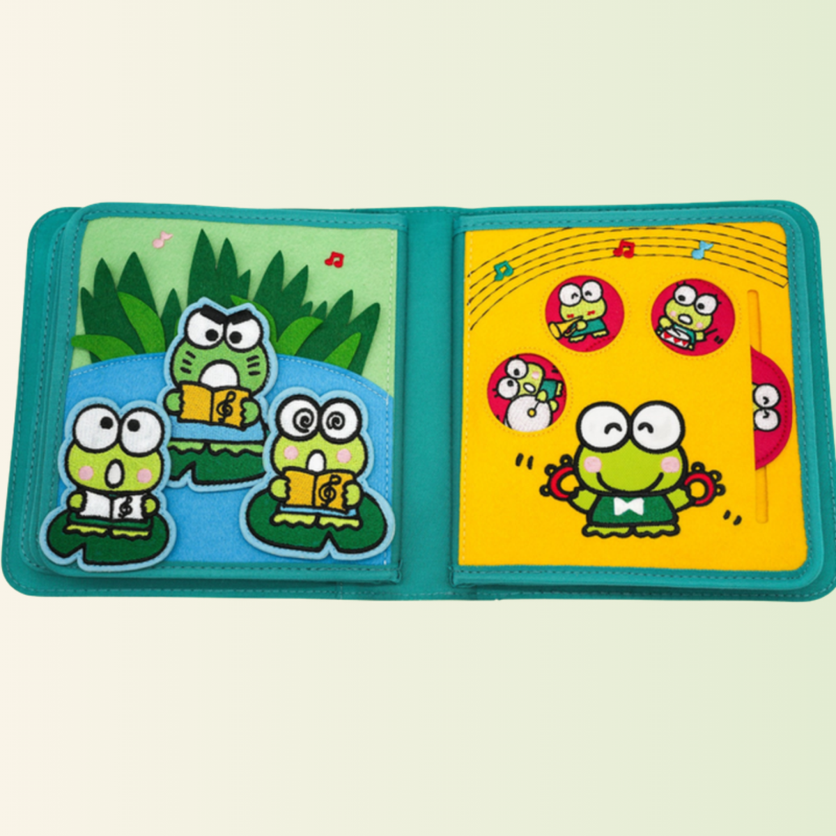 Keroppi quiet book – frog concert with slider, cut out on a soft meadow background