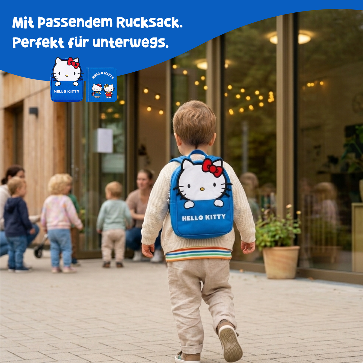 Toddler carrying the blue Hello Kitty backpack out and about – quiet book with matching backpack from 1 year